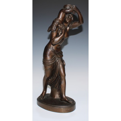 24 - A 19th century brown patinated library sculpture, Baccante and Infant Faun, oval base, 45.5cm high, ... 