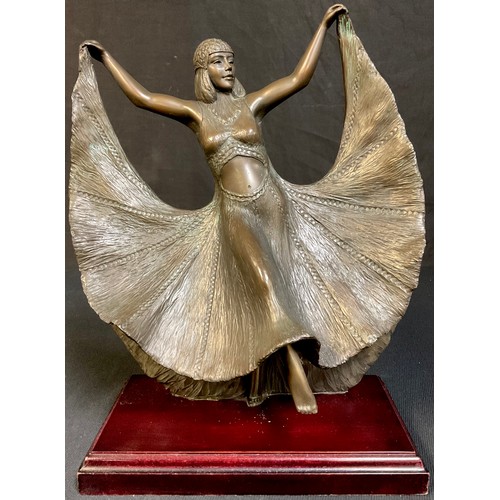 38 - David Smith, a dark patinated reproduction bronzed Art Deco style dancing girl, stepped mahogany bas... 