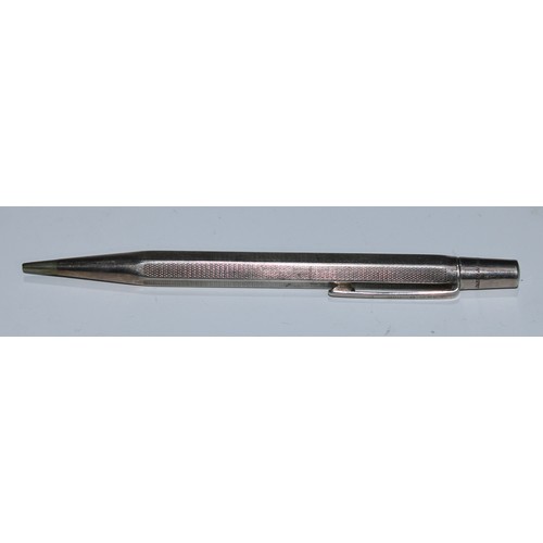 59 - Pens - a 19th century silver coloured metal propelling pencil, wrthen-fluted, the terminal set with ... 