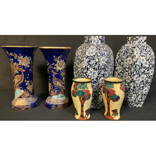 66 - A pair of Carlton Ware Kang He rockery and pheasant lustre vases, 19.5cm high; a pair of Royal Doult... 