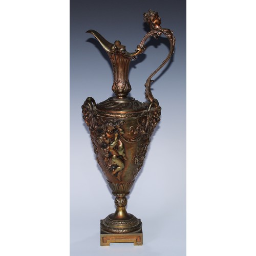 92 - A Renaissance Revival gilt bronze Cellini type ewer, boldly cast with Bacchic masks, revelling putti... 