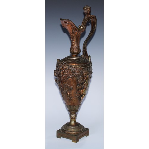 92 - A Renaissance Revival gilt bronze Cellini type ewer, boldly cast with Bacchic masks, revelling putti... 