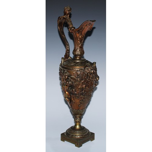 92 - A Renaissance Revival gilt bronze Cellini type ewer, boldly cast with Bacchic masks, revelling putti... 