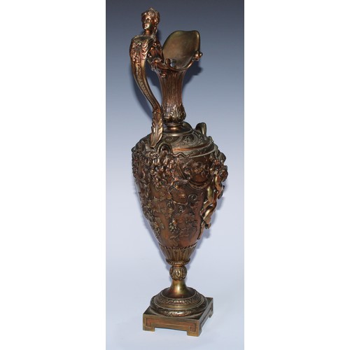 92 - A Renaissance Revival gilt bronze Cellini type ewer, boldly cast with Bacchic masks, revelling putti... 