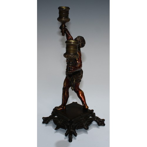 93 - A European gilt and brown patinated bronze figural candelabra, cast as a Mannerist faun, square base... 