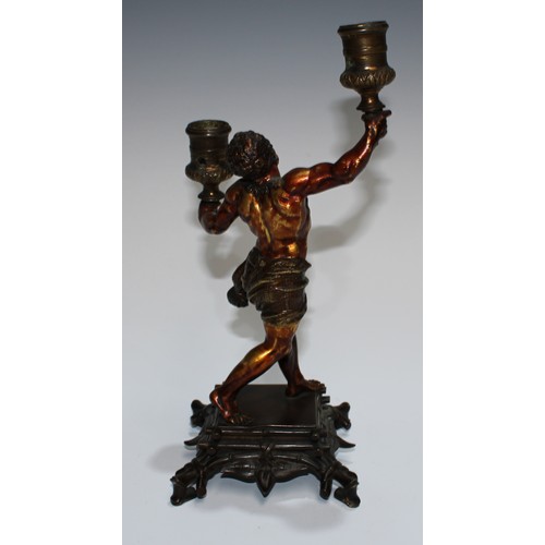 93 - A European gilt and brown patinated bronze figural candelabra, cast as a Mannerist faun, square base... 