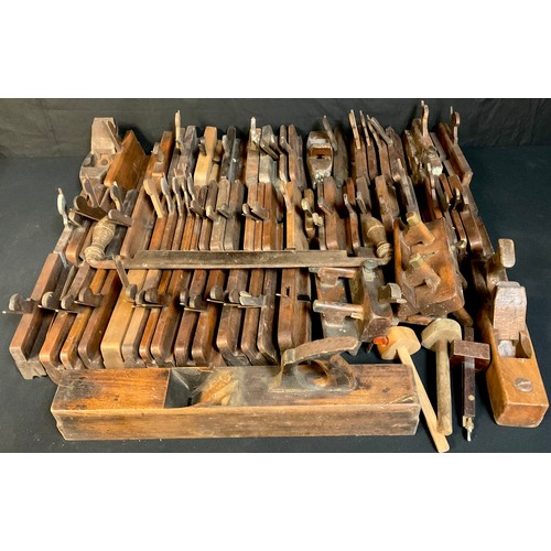 688 - Carpentry Tools - a quantity of 19th century and later wooden moulding planes, various sizes, approx... 