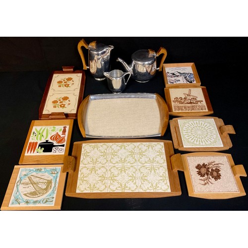 704 - A mid-20th century Piquot ware tea service on tray; similar retro cheese boards, set with tiles; qty