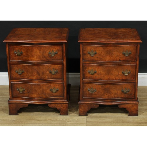 102 - A pair of George III style burr elm serpentine chests, of small proportions, each crossbanded top ou... 