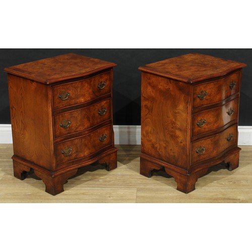 102 - A pair of George III style burr elm serpentine chests, of small proportions, each crossbanded top ou... 