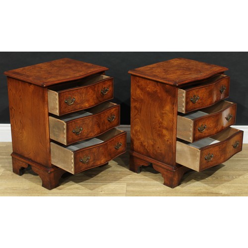 102 - A pair of George III style burr elm serpentine chests, of small proportions, each crossbanded top ou... 