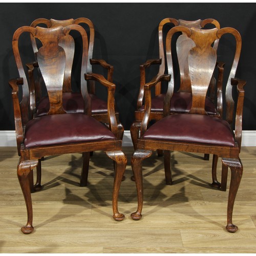 111 - A set of four George I Revival walnut elbow chairs, vasular splats, drop-in seats, cabriole forelegs... 