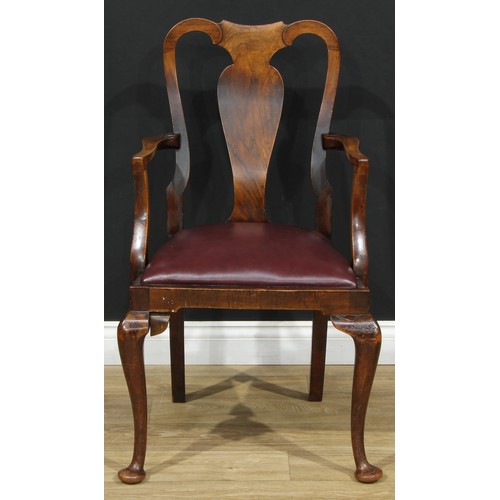 111 - A set of four George I Revival walnut elbow chairs, vasular splats, drop-in seats, cabriole forelegs... 