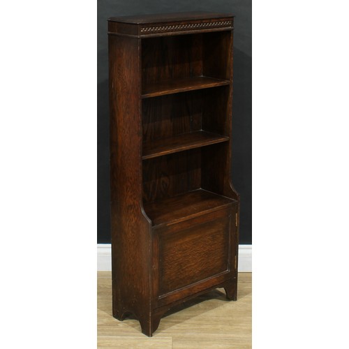 711 - An early 20th century oak bookcase, cupboard to base, 114cm high, 47cm wide, 22cm deep