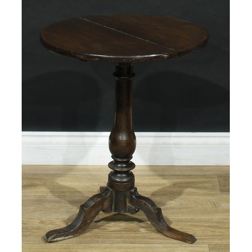 714 - An oak tripod occasional table, 60cm high, 50cm diameter