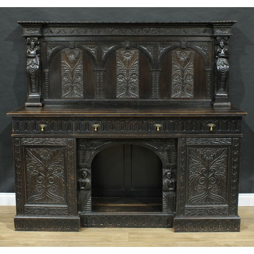 717 - A 17th century style dog kennel sideboard, the back carved and applied with figural pilasters, the b... 