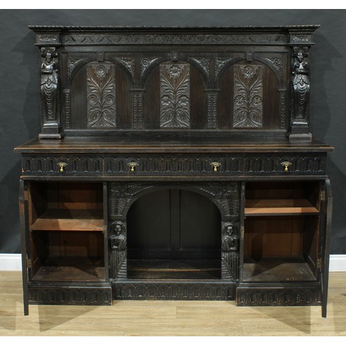 717 - A 17th century style dog kennel sideboard, the back carved and applied with figural pilasters, the b... 