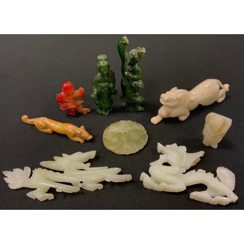 135 - A carved soapstone figure stalking Foo dog; others, dragons, elders, stylised fox etc (9)