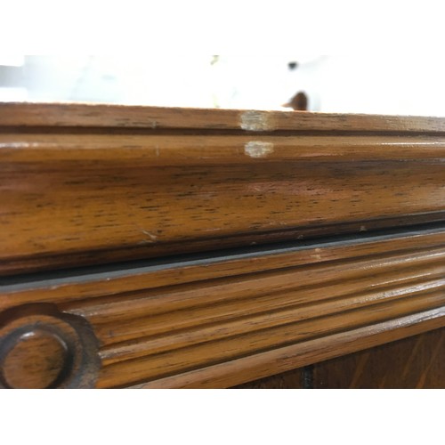 147 - A mid 20th century oak veneered bedroom suite by Austinsuite, comprising two double wardrobes and a ... 