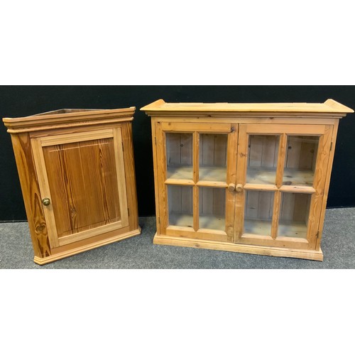 152 - An early 20th century farmhouse pine wall unit, glazed panel doors, ogee cornice, , 94cm wide, 77cm ... 