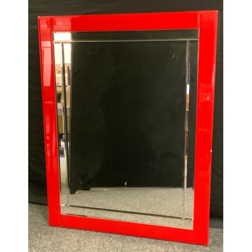 155 - A Contemporary rectangular wall mirror, sectional bevelled plates, conforming red surround, 117cm x ... 