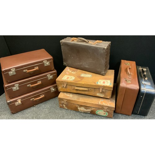 157 - A set of three graduated Kazeto traveling suitcases, largest 22cm high, 64cm wide, 41cm deep; a pair... 