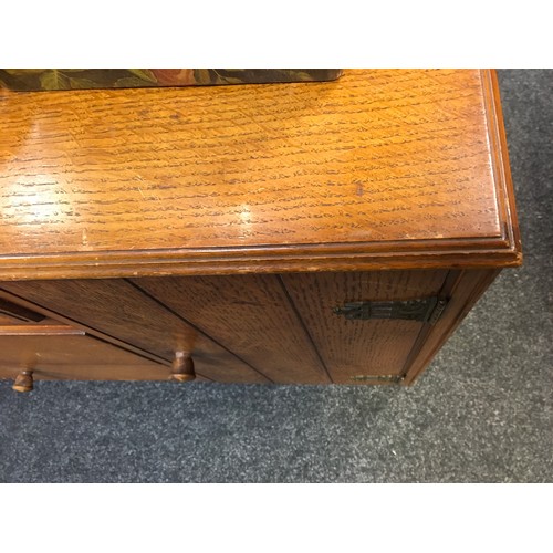 47 - A mid 20th century oak veneered bedroom suite by Austinsuite, comprising two double wardrobes and a ... 