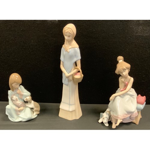 109 - A Lladro  figure, of a girl with cat and dog, 5640;  a Lladro figure, of a girl on a telephone, 5466... 