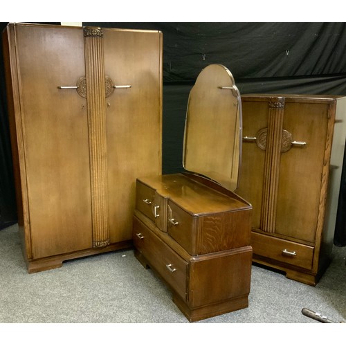 240 - An Art Deco oak three-piece bedroom suite, comprising a double wardrobe 183cm high, 116cm wide; a C.... 