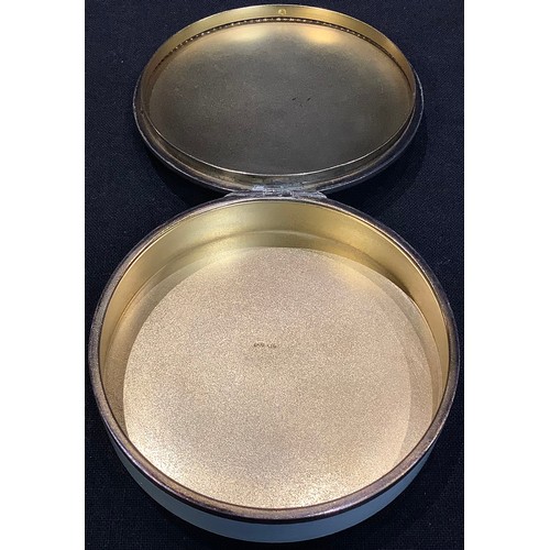 67 - An early 20th century silver and guilloche enamel circular box, the cover border set imitating rubie... 