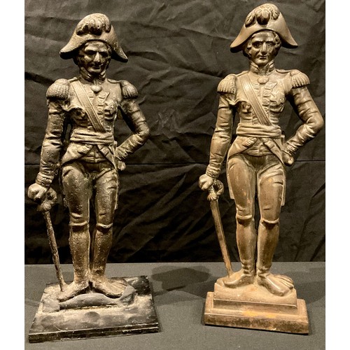 88 - Military Interest - two 19th century cast iron doorstops or door porters, cast as military figures, ... 