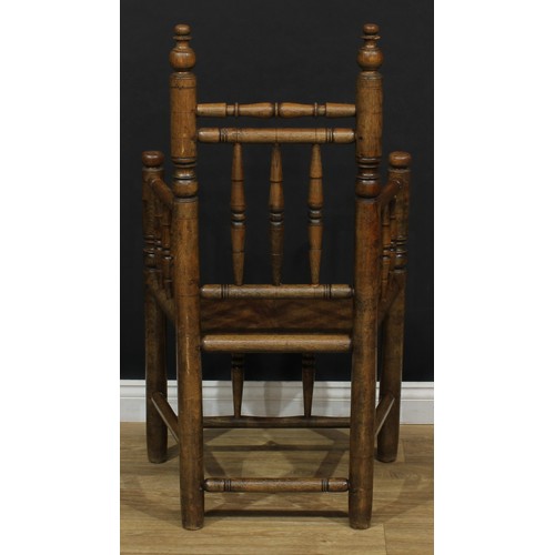 4 - A 17th century style turner's chair, 109.5cm high, 62.5cm wide, the seat 42cm wide and 38cm deep