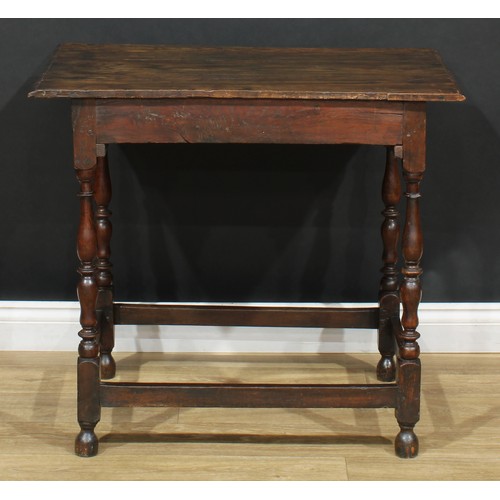 16 - An 18th century design oak side table, oversailing top above a long frieze drawer, turned supports, ... 