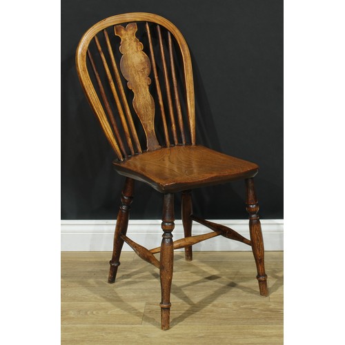 17 - A pair of 19th century Windsor-form side chairs, each with a hoop back, shaped splat, saddle seat, t... 