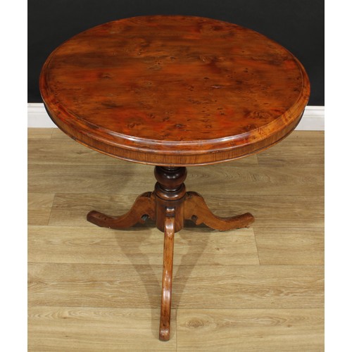 18 - A 19th century vernacular tripod centre table, possibly Welsh, circular yew top, turned column, cabr... 