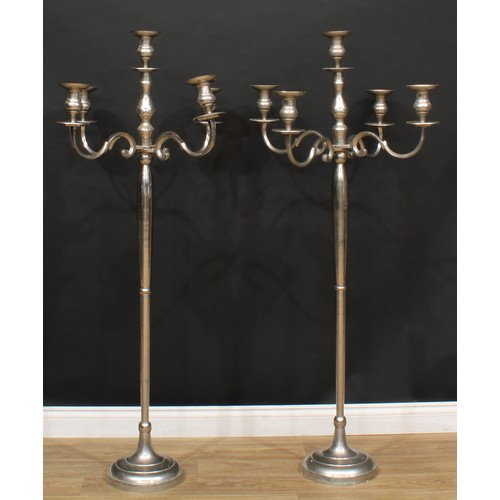 110 - A pair of contemporary floor-standing candelabra, 153cm high, 74cm wide (2)