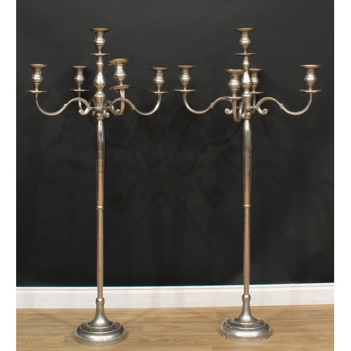 110 - A pair of contemporary floor-standing candelabra, 153cm high, 74cm wide (2)