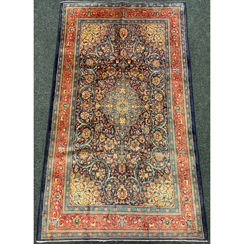 165 - A Persian Sarough rug / carpet, having a diamond shaped medallion within a central field densely wov... 