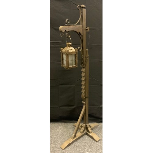 170 - A mid 20th century oak standing lantern, adjustable ratchet ,167cm high.