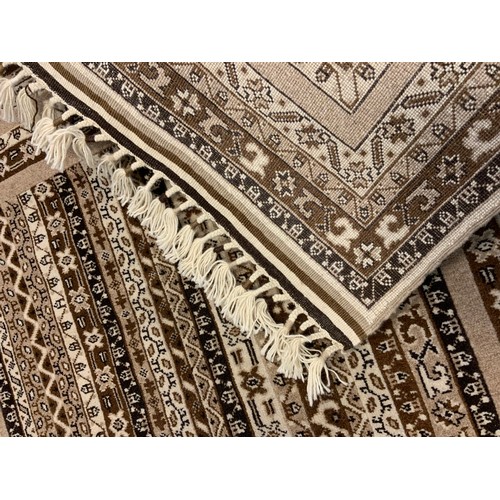 210 - A fine hand-made Telle Torkaman rug / carpet, woven in muted tones of umber, brown, and cream, 190cm... 