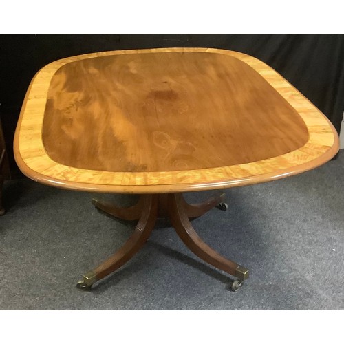 219 - A tilt-top mahogany breakfast table, crossbanded satinwood, rounded rectangular top, cylindrical col... 