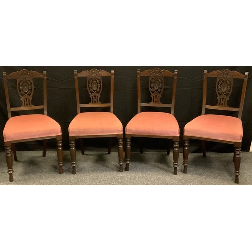 237 - A set of four Victorian mahogany dining chairs, carved cresting rail and splat, turned legs.(4)