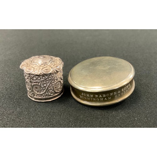 283 - A silver coloured metal cased novelty tape measure, ornate tubular barrel case, all over decorated w... 