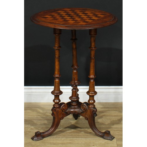 8 - A Victorian walnut, rosewood, oak and mahogany games table, circular top inlaid for chess, turned co... 