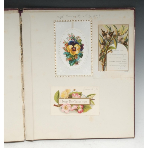 321 - A mid-Victorian and later scrapbook, enclosing chromolithograph printed Christmas and other greeting... 