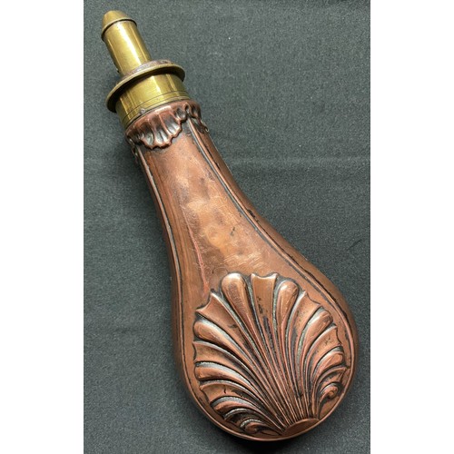 191 - A Brass and Copper Powder Flask embossed with a design of a Clam Shell. Four adjustable measures of ... 