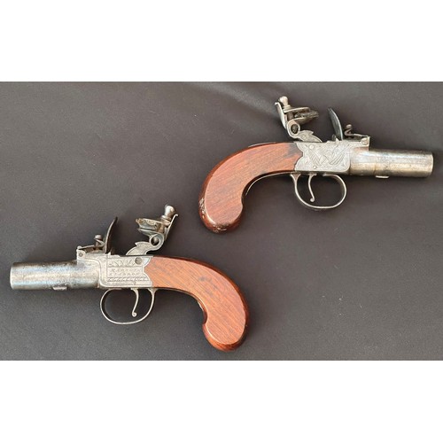 201 - A matched pair of Flintlock Pocket Pistols by 