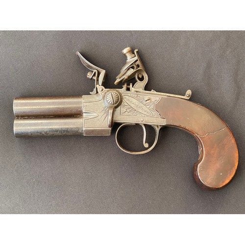 205 - A scarce Double Barrel Over and Under Flintlock Tap Action Pistol by Wheeler & Sons London. 65mm lon... 