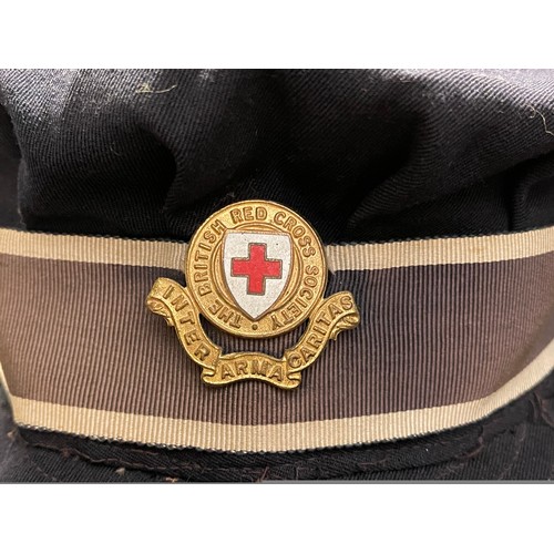 94 - WW2 British Red Cross Society Womans Peaked Cap complete with cap badge. Maker marked 