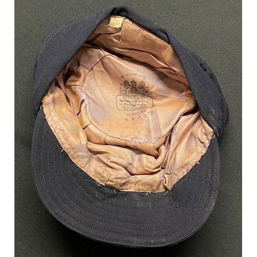 94 - WW2 British Red Cross Society Womans Peaked Cap complete with cap badge. Maker marked 